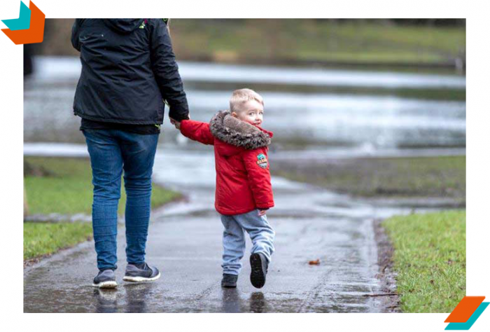 Small-Boy-Walking-with-Parent